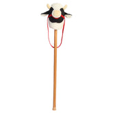 A spotted Holstein cow plush stick toy with a soft cow head and wooden stick from Aurora’s Giddy-Up Friends collection.