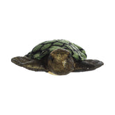Plush toy of a green sea turtle with a soft, patterned shell and textured flippers.