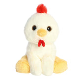 A soft white plush chicken with yellow wings and feet and a red comb from Lil Dreamers by Aurora.