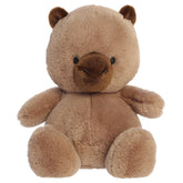 A capybara plush toy from Aurora with tiny limbs, brown fur, and a plump bean-weighted body.