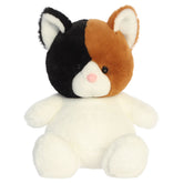 A calico kitten plush toy from Aurora with tiny limbs, a calico pattern, and a plump bean-weighted body.