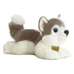 A grey and white Husky plush toy from Miyoni by Aurora with vivid blue eyes and a soft, cuddly build.