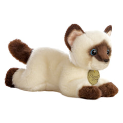 A Siamese cat plush toy from Miyoni by Aurora with creamy fur, dark points, and vibrant blue eyes.