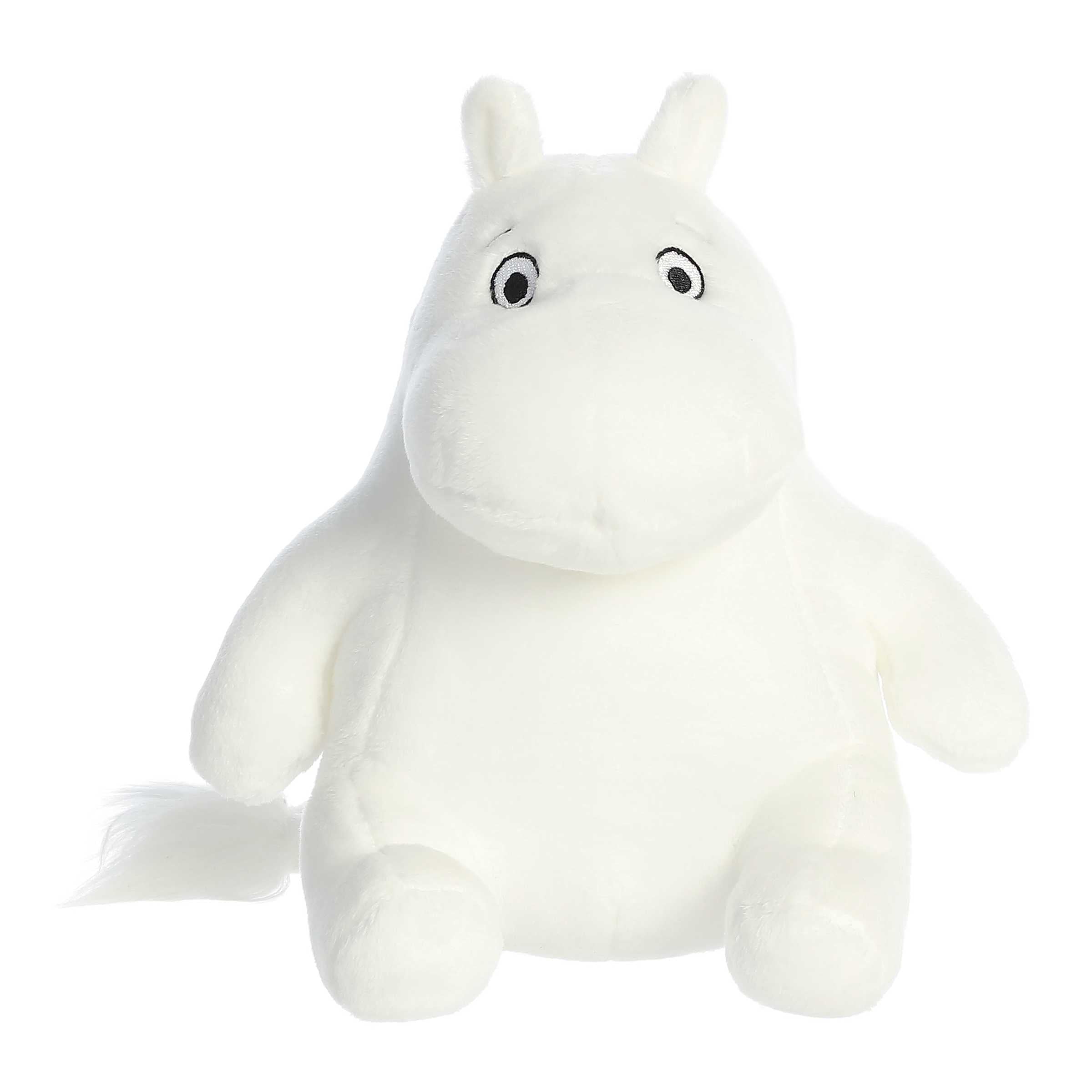 A Soft white Moomin plush in a seated position, with the iconic plump body and expressive eyes, ready for cozy snuggles