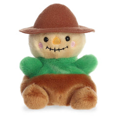 Cornelius Scarecrow plush from Palm Pals in a green outfit and brown hat, perfect for autumn charm and cuddles.