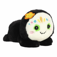 Colorful sugar skull plush with a huggable posture, perfect for embracing cultural festivities.