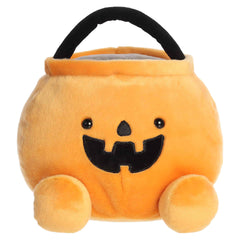 Oversized orange pumpkin candy bucket plush with a smiling jack-o'-lantern face
