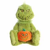 Grinch plush holding a plush pumpkin, from Dr. Seuss collection, ready to add mischief and festive fun