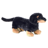 A black Dachshund plush toy from Mini Flopsie by Aurora with short legs and expressive eyes.