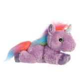 A lavender unicorn plush toy from Aurora with a rainbow mane, silver hooves, and a dazzling silver horn