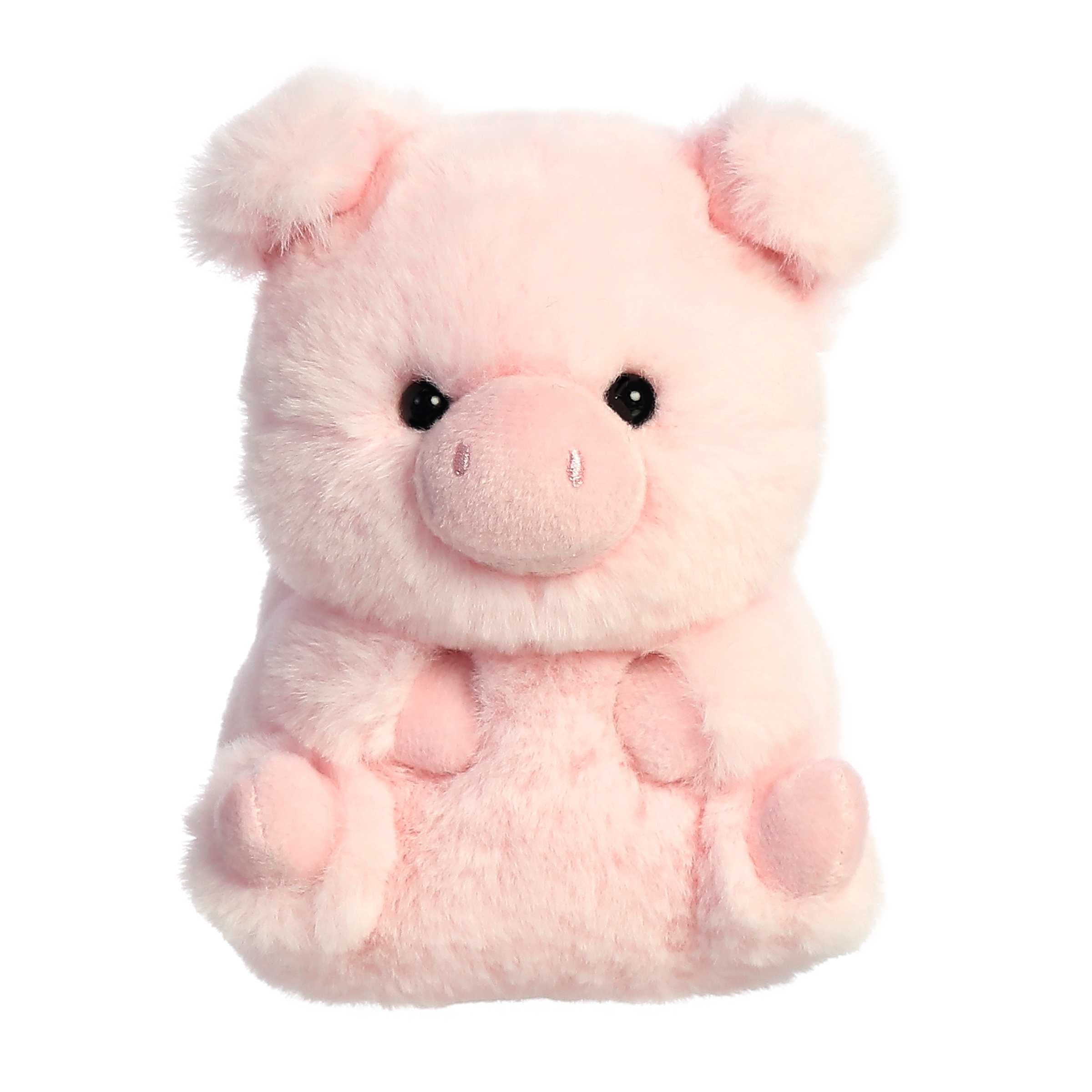 A pink pig plush toy from the Rolly Pet collection by Aurora with a round body and a playful expression