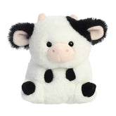 A black and white cow plush toy from the Rolly Pet collection by Aurora with a rounded body and sweet expression.