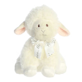 Musical plush Blessings Lamb by ebba with pink ears and 'Jesus Loves Me' ribbon, perfect for nursery comfort and decor.
