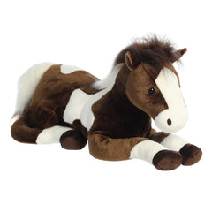 Large paint horse plush toy with a brown and white patterned coat and realistic equine detailing