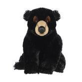 Plush black bear with velvety fur and soulful eyes for soothing bedtime companionship.