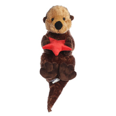 Plush brown otter holding a red starfish with a cheerful face and soft fur.