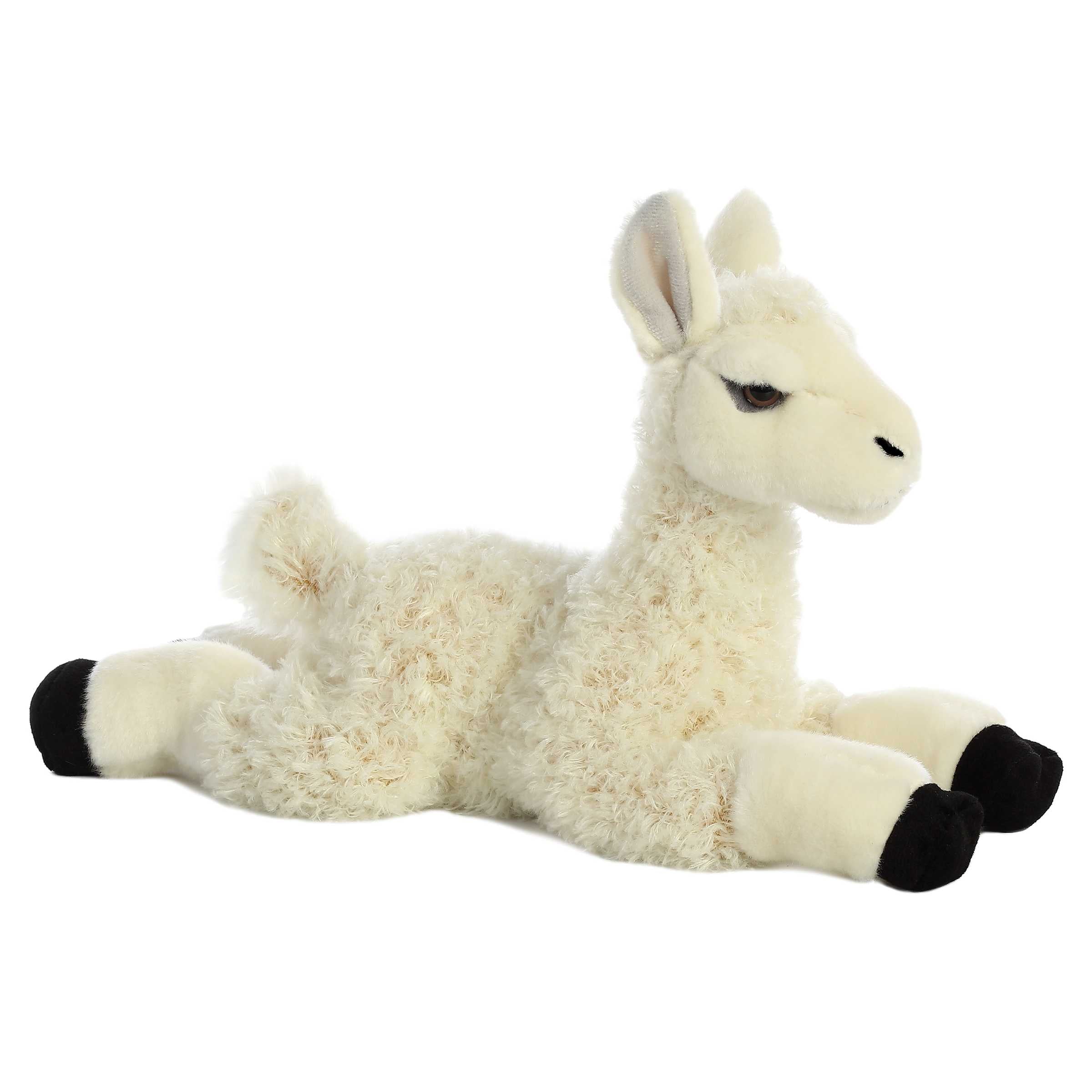 Plush toy of a white llama with curly fur, black hooves, and gentle eyes by Aurora stuffed animals.
