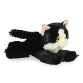 A black and white kitten plush toy from Mini Flopsie by Aurora with yellow eyes and a pink nose.