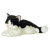 Plush black and white cat with green eyes and a soft, relaxed body by Aurora stuffed animals.