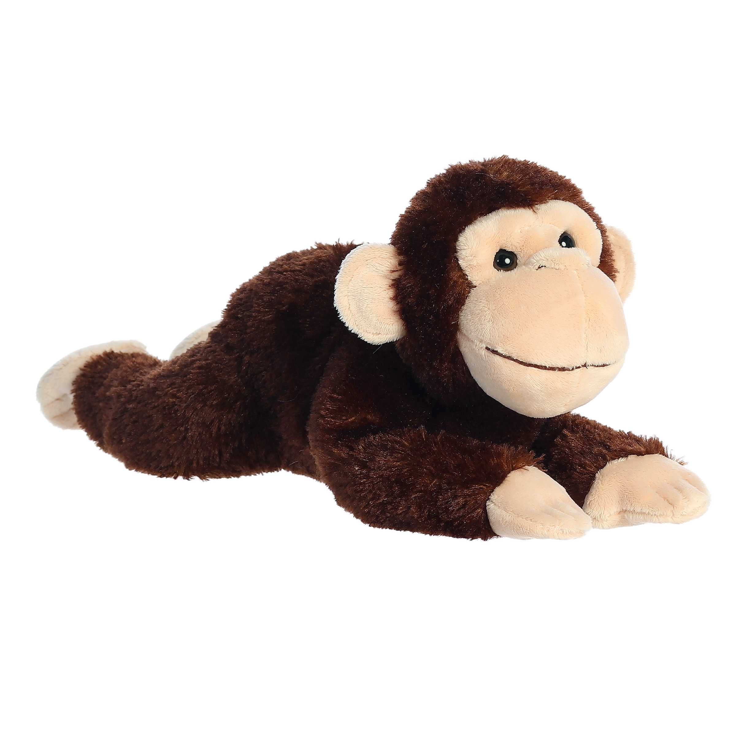 Plush toy of a chimp with dark brown fur, tan face, and floppy arms and legs by Aurora stuffed animal.