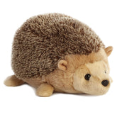 A hedgehog plush toy with fuzzy quills, small ears, and a soft, round shape by Aurora stuffed animals.