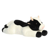 A large black-and-white plush cow with a pink snout and gentle expression from Super Flopsie by Aurora.