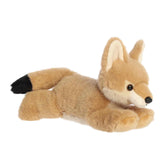 A soft tan plush coyote with pointed ears and a floppy body from Flopsie by Aurora.
