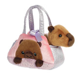 A pastel pink and lavender carrier with a removable brown capybara plush from Fancy Pals by Aurora.
