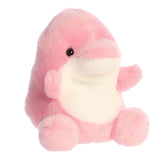 Plush toy of a pink dolphin by Palm Pals with a round white belly, flippers, and a sweet smiling face.