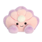 A small pink oyster plush with lavender edges and a pearl inside from Palm Pals by Aurora.