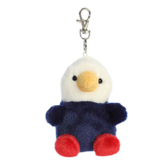 A small red, white, and blue eagle plush clip-on with a gold beak from Palm Pals by Aurora.