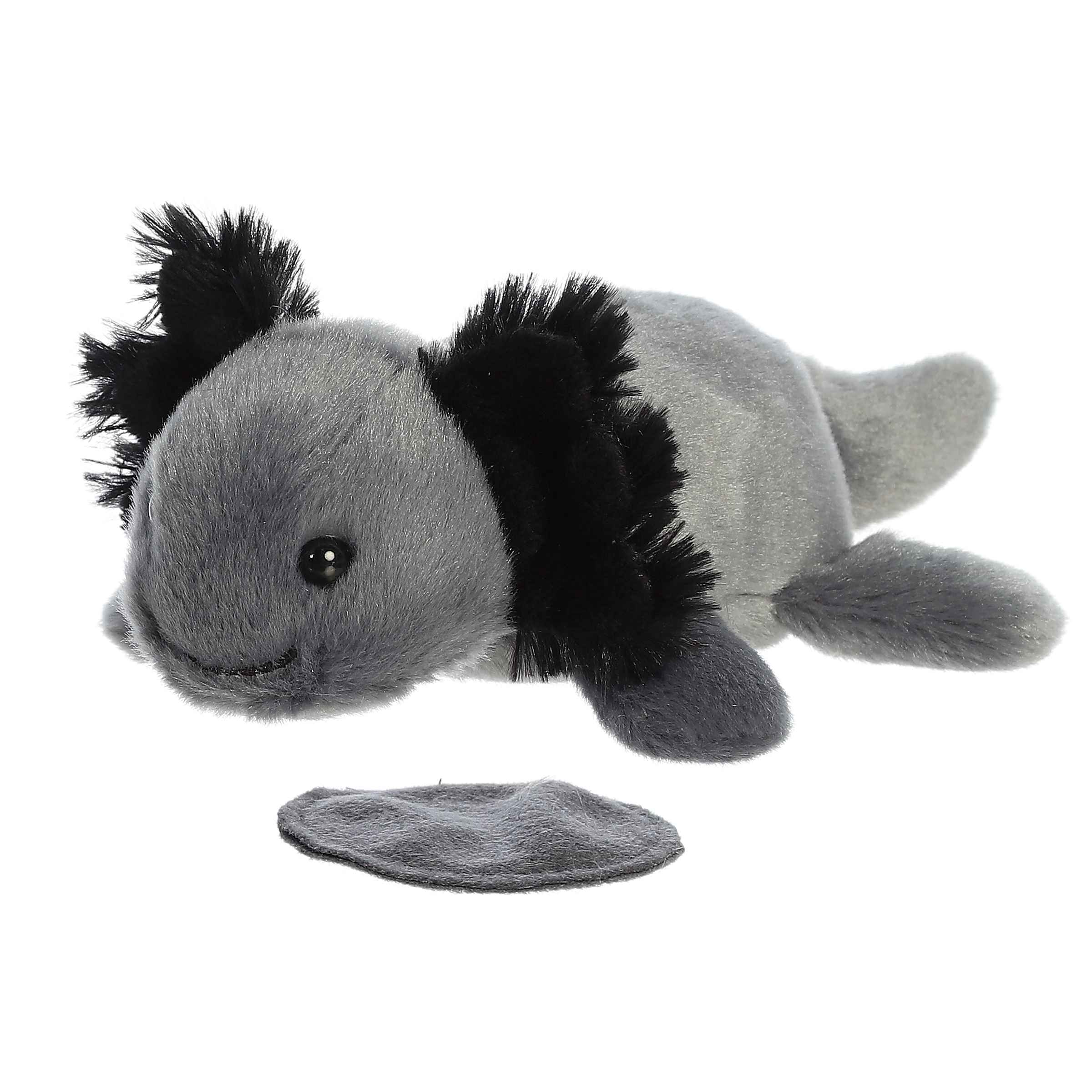 Plush toy of Ebon Black Axolotl from the Shoulderkins collection with a magnetic base and soft black body.