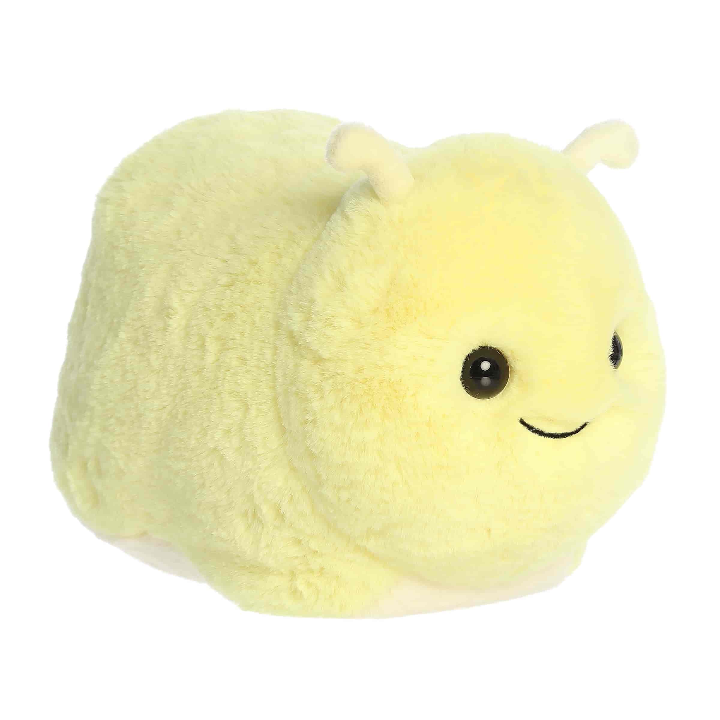 A round yellow banana slug plush with a sweet smile and soft texture from Spudsters by Aurora.