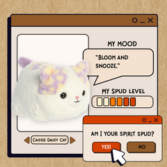 A spudsters product card for the white cat plush with pastel lavender, yellow, and orange spots by Aurora