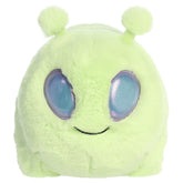 An alien plush toy from Aurora with a rounded potato shape, green fur, and playful cosmic details.