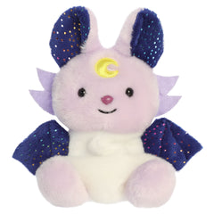 A fantasy beast plush toy from Aurora with a light-colored body, deep blue wings, and sweet embroidered features.