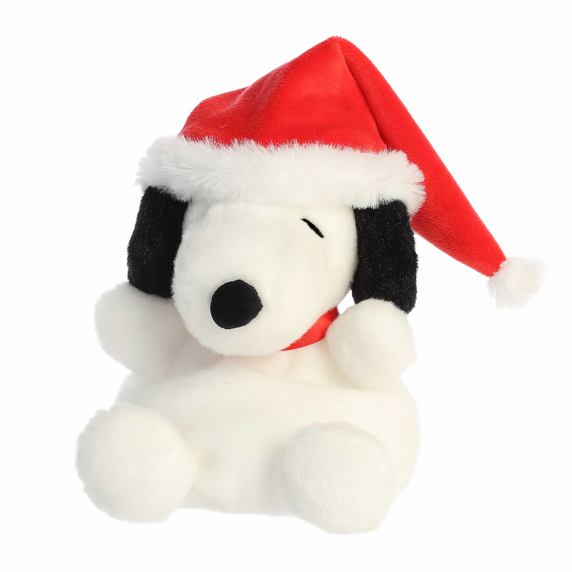 Snoopy plush with floppy ears and red Santa hat, soft and festive—perfect for Peanuts fans