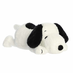 Snoopy plush from the Peanuts Collection by Aurora, laying flat on his tummy, crafted for durable and soft cuddles