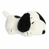 Cuddles Snoopy plush from the Peanuts Collection by Aurora, designed to lie down with open arms