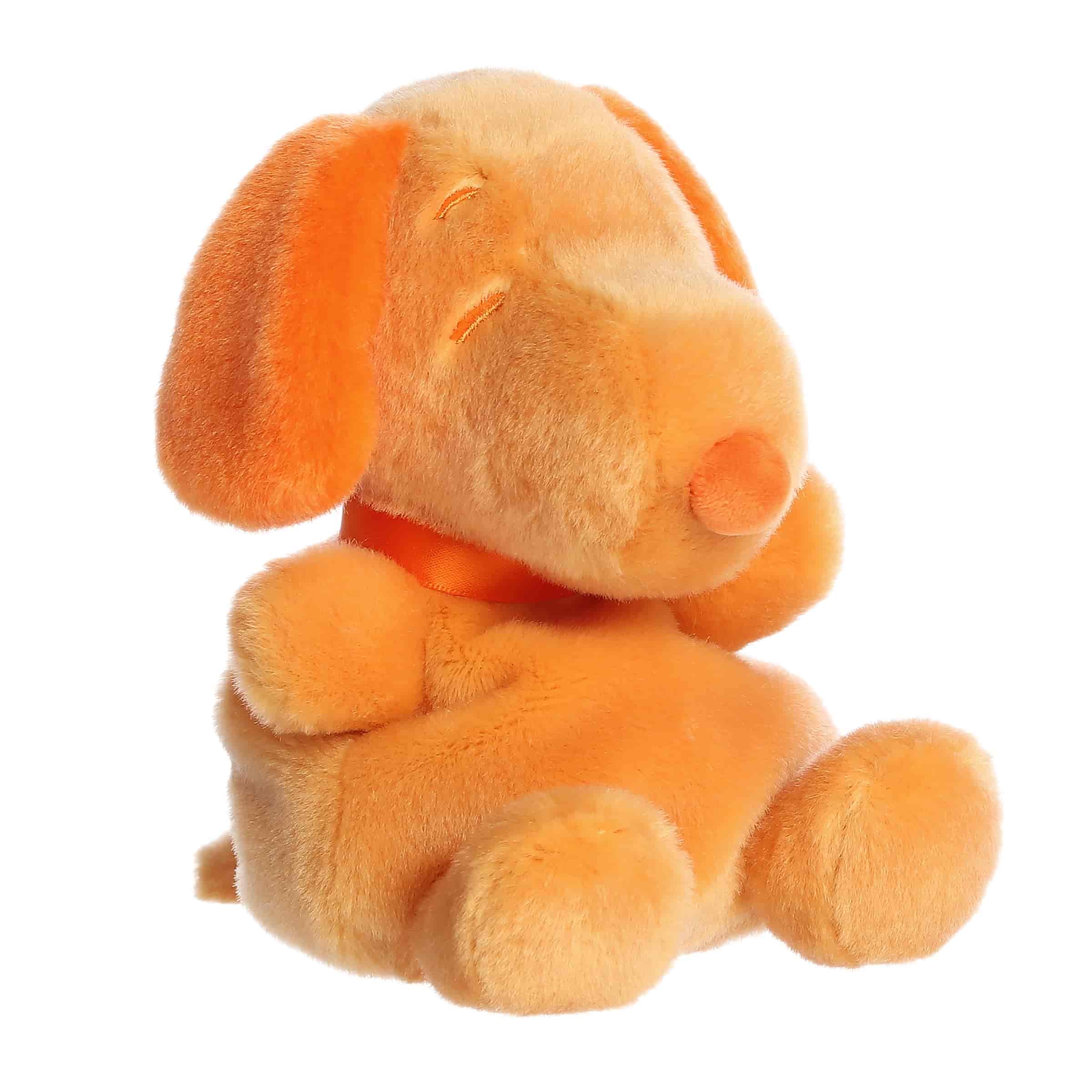 An orange Snoopy plush beagle with soft fabric and cheerful smile from Palm Pals Snoopy Color Collection.