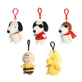 A Peanuts Mini Plush Surprise red doghouse box with mystery Snoopy and friends clip-on plush inside
