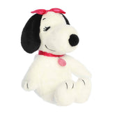 A Belle plush beagle with soft white fur, pink bow, and kind expression from the Peanuts collection