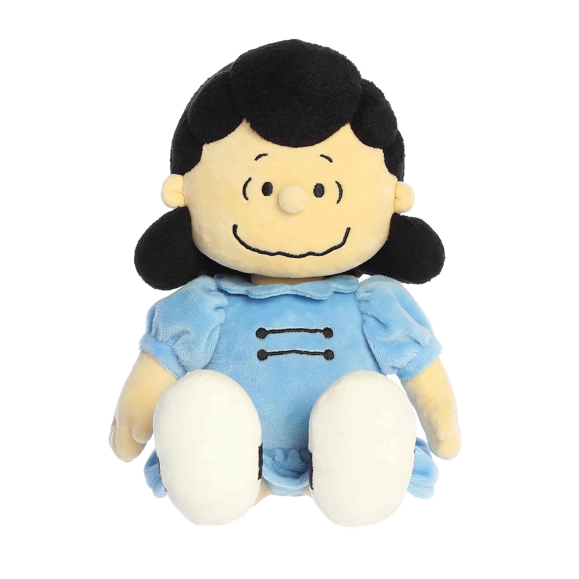 A Lucy plush wearing a blue dress with black hair and a confident smile from the Peanuts collection