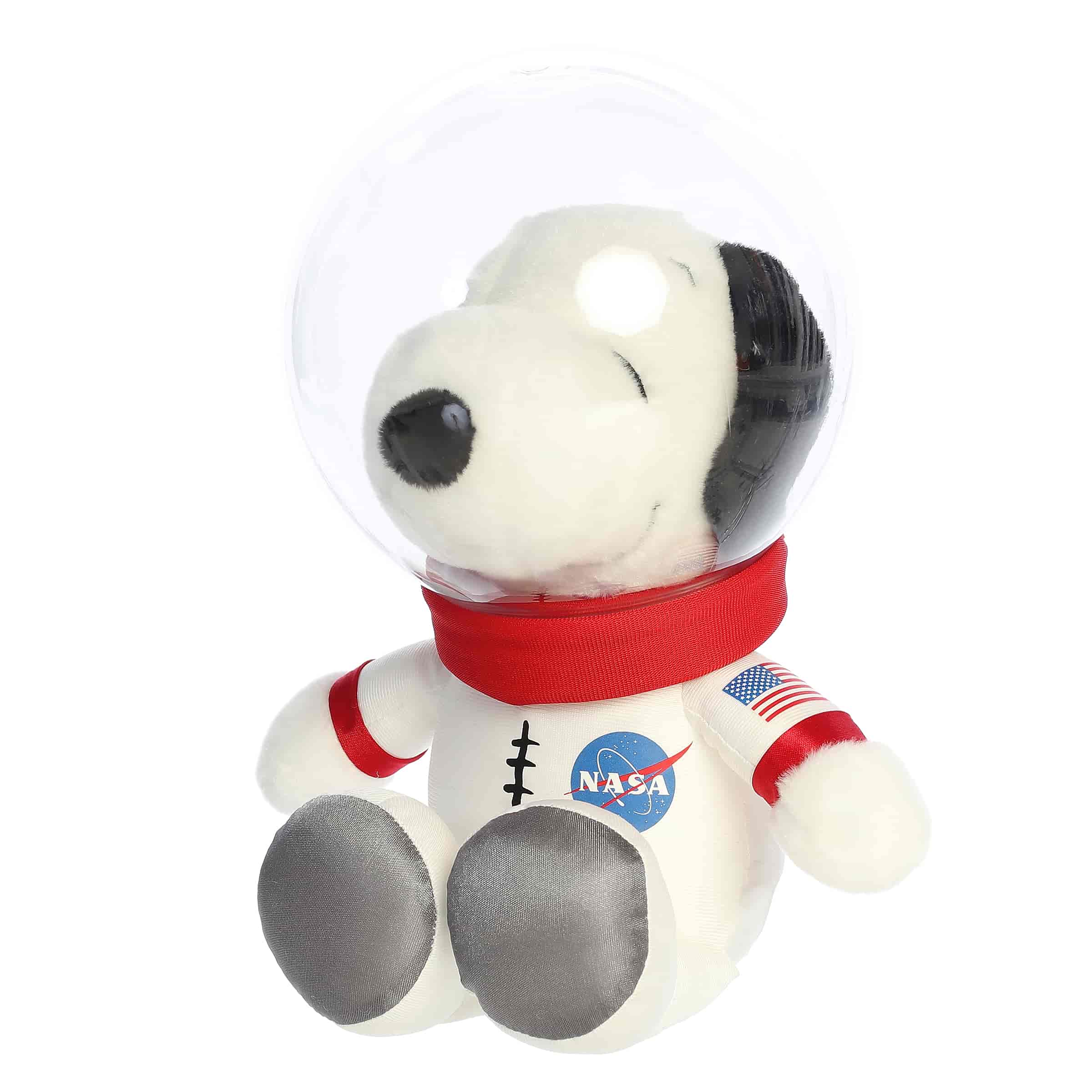 A Snoopy plush wearing a white astronaut suit with a clear helmet from the Peanuts collection by Aurora.