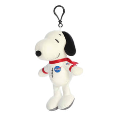 A Snoopy keychain plush wearing a white astronaut suit with NASA logos from the Peanuts collection by Aurora.