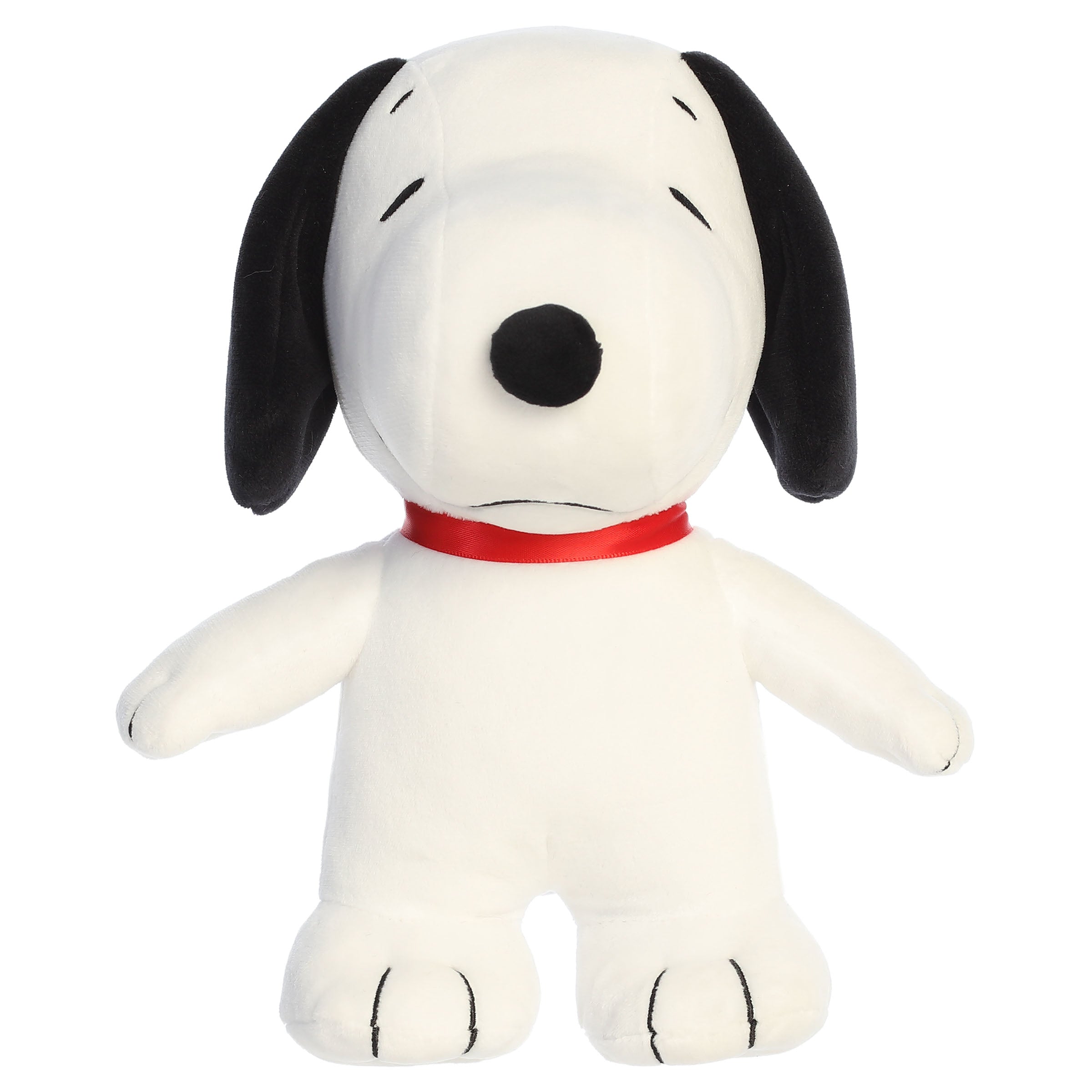 A Snoopy plush toy from Aurora with his signature look and beans in his feet.