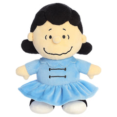 A Lucy plush toy from Aurora with her signature look and beans in her feet.