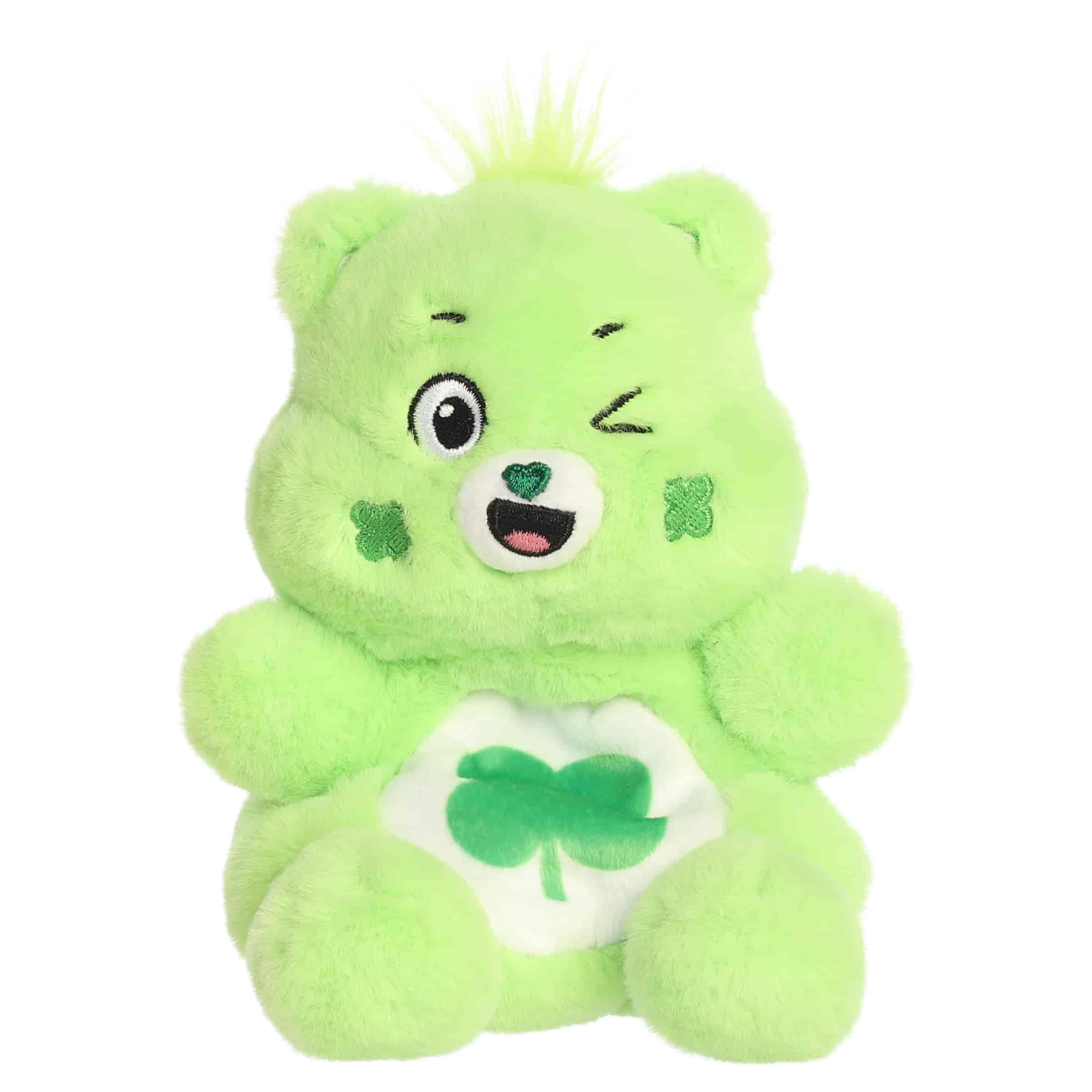 Good Luck Bear Palm Pals plush with soft green fur, winking face, round ears, and shamrock belly badge