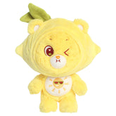 Funshine Lemon Care Bears plush with yellow lemon outfit, winking face, leafy detail, and sun belly badge