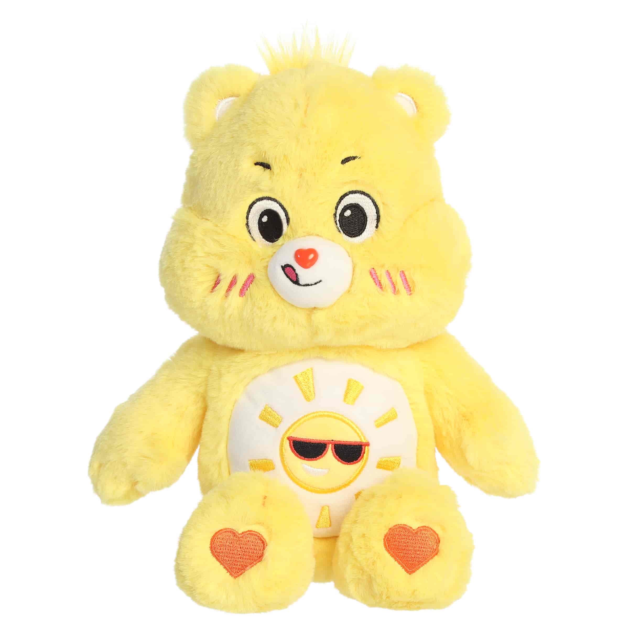 Funshine Bear plush with soft yellow fur, cheerful face, round ears, and smiling sun belly badge